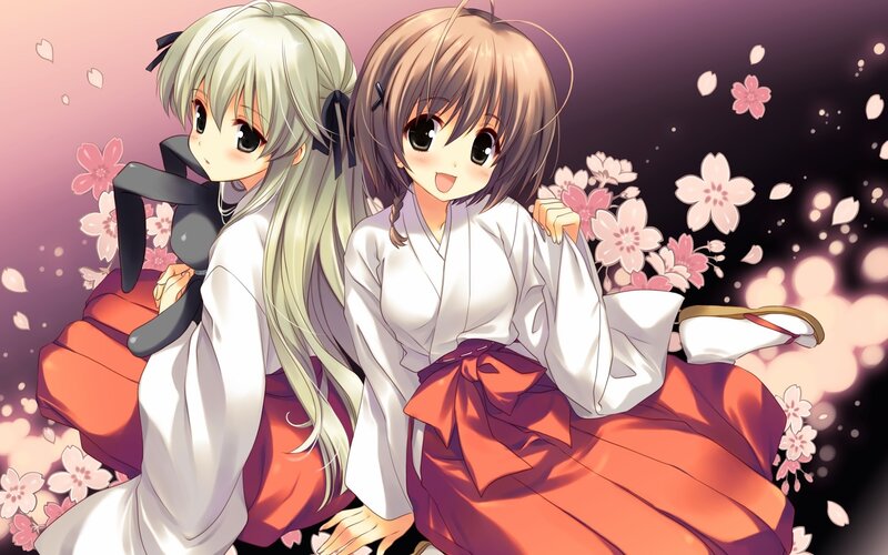 Two girls in kimonos with cherry blossoms