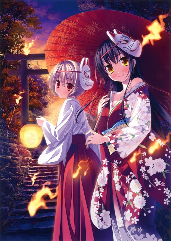 Two girls in kimonos with fox masks