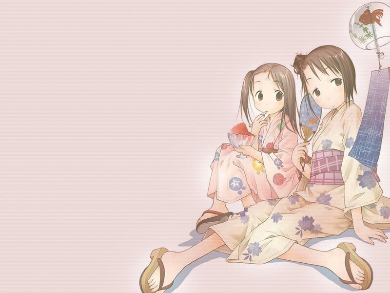 Two girls in kimonos with ice cream