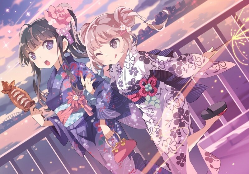 Two girls in kimonos with sparklers