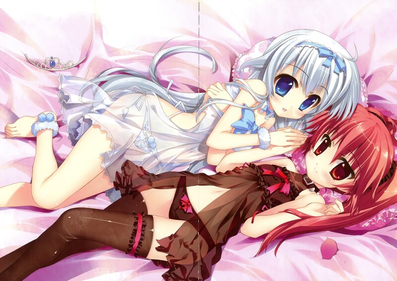 Two girls in lingerie on a bed