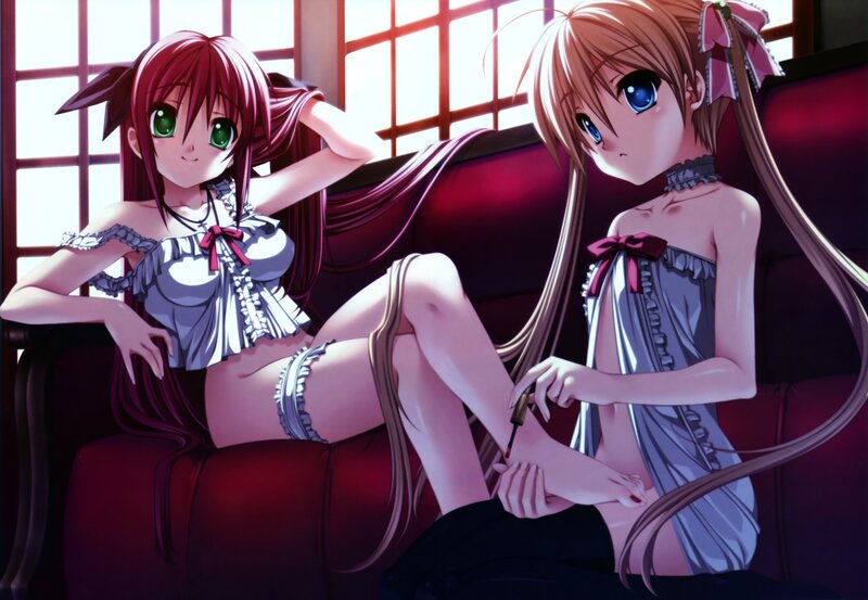 Two girls in lingerie on a couch