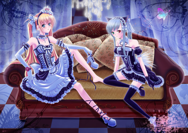 Two girls in maid outfits on a sofa