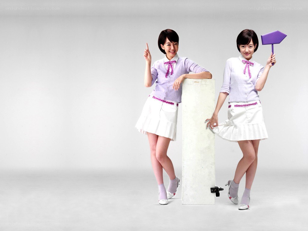 two girls in matching outfits