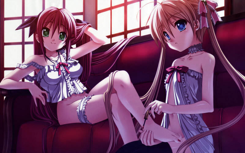Two girls in nightwear on a couch
