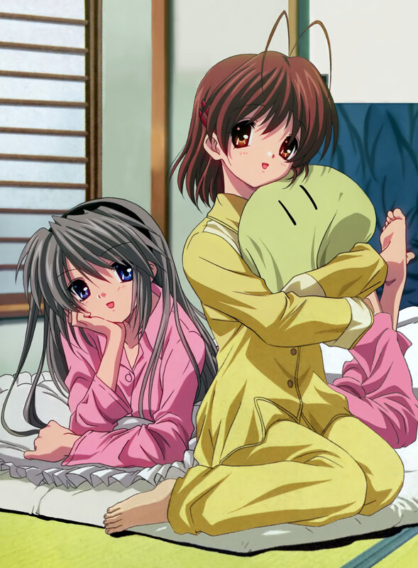 Two girls in pajamas on a bed
