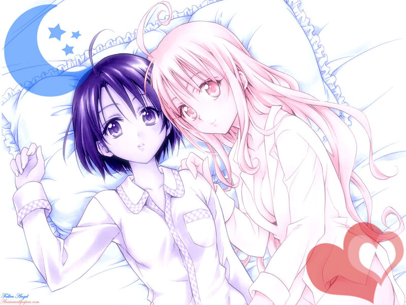 Two girls in pajamas on a bed