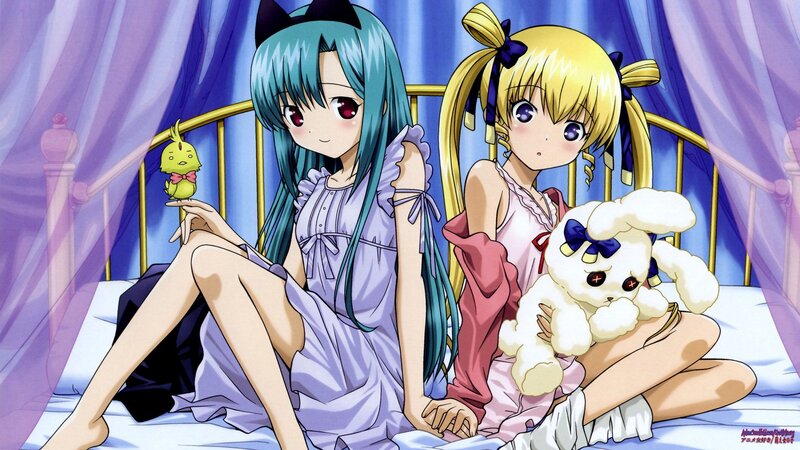 Two girls in pajamas on a bed