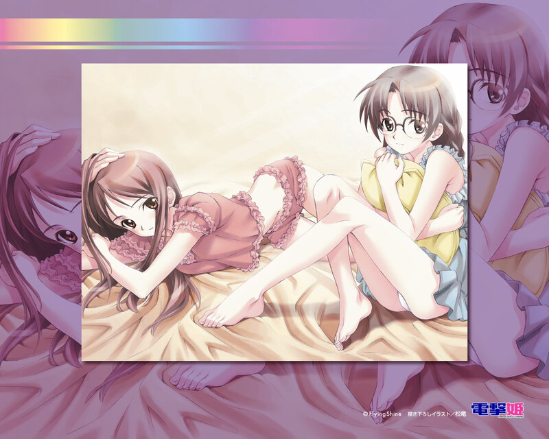 Two girls in pajamas on a bed