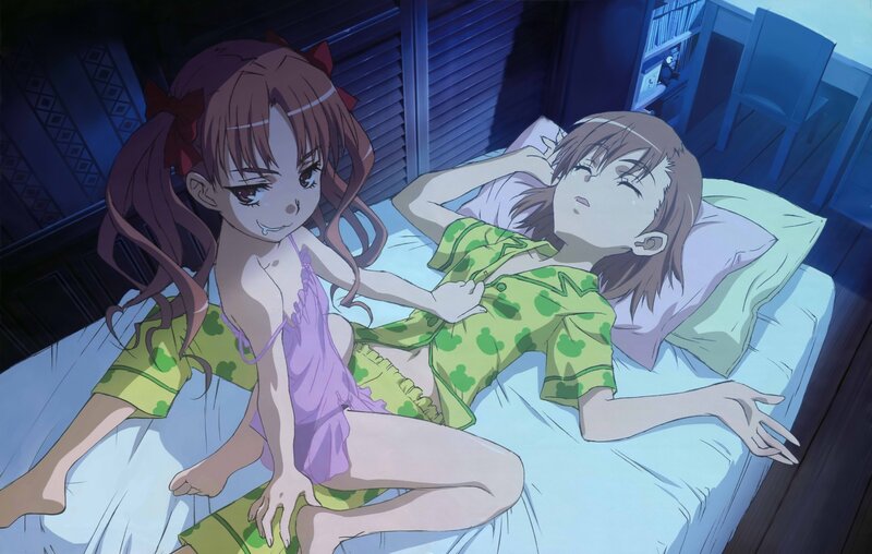 Two girls in pajamas on a bed