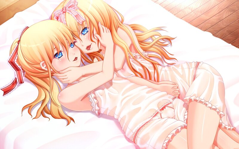 Two girls in pajamas on a bed