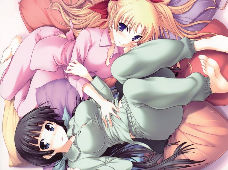 Two girls in pajamas on a bed
