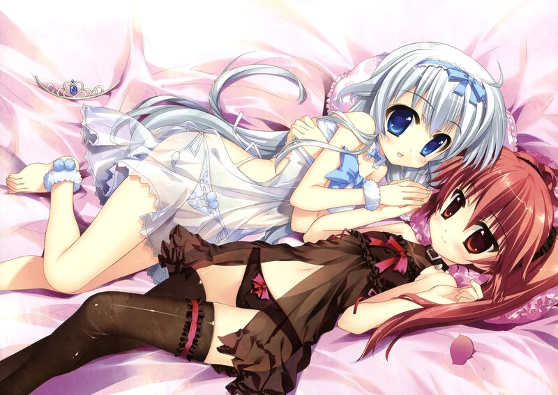 Two girls in pajamas on a bed