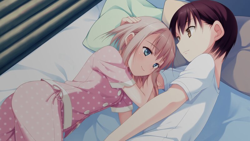 Two girls in pajamas on a bed