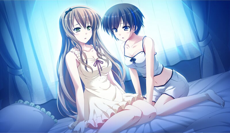 Two girls in pajamas on a bed