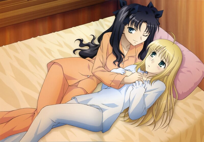 Two girls in pajamas on a bed