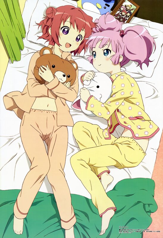 Two girls in pajamas on a bed