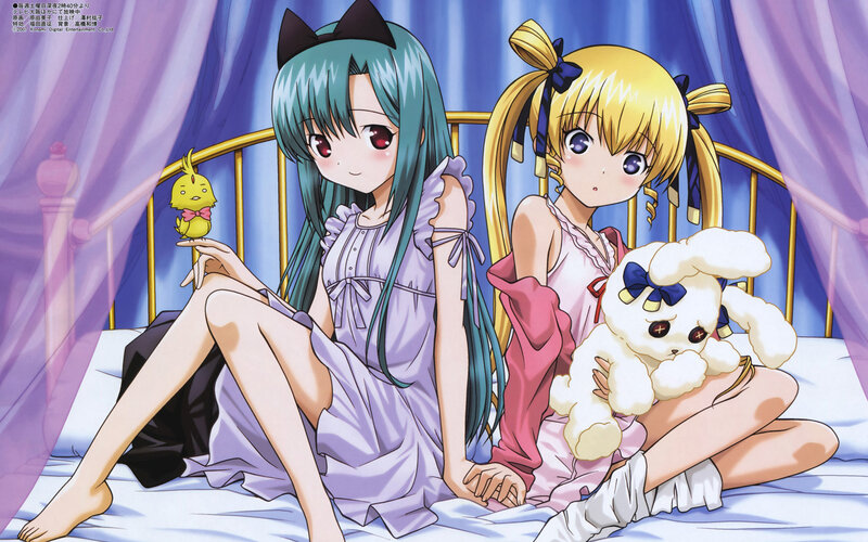 Two girls in pajamas on a bed