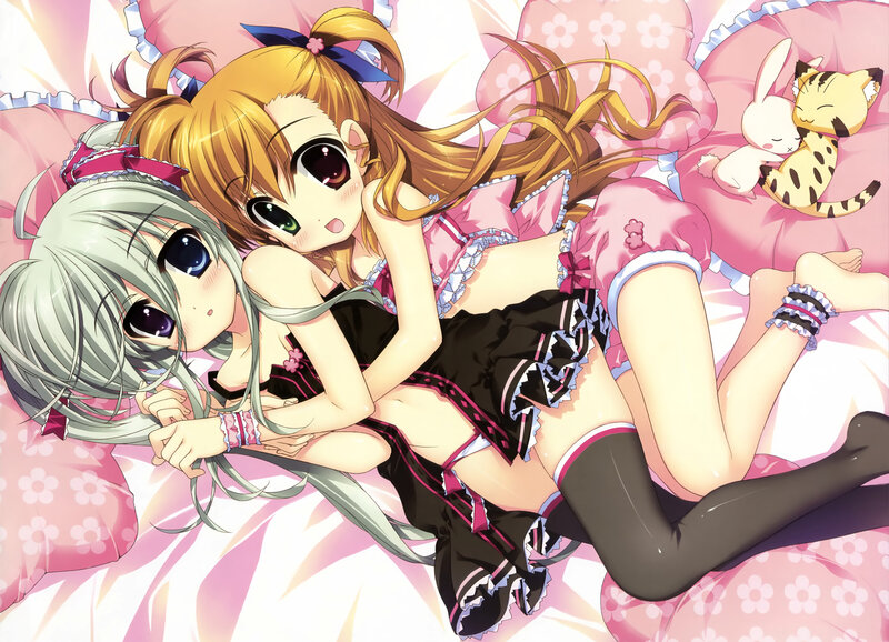 Two girls in pajamas on bed