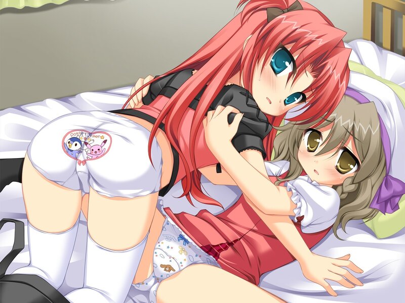 Two girls in pajamas on bed