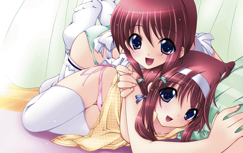 Two girls in pajamas on bed