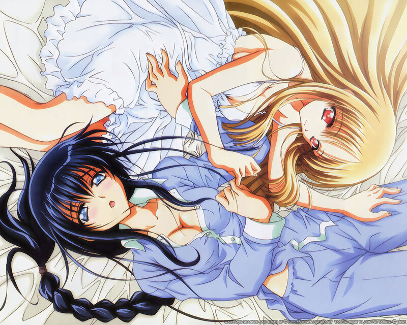 Two girls in pajamas on bed