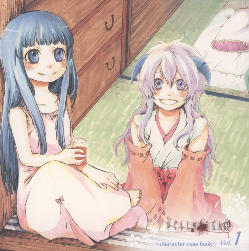 Two girls in pajamas sitting on floor