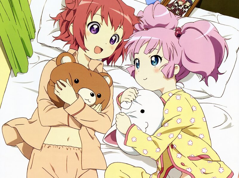 Two girls in pajamas with stuffed animals