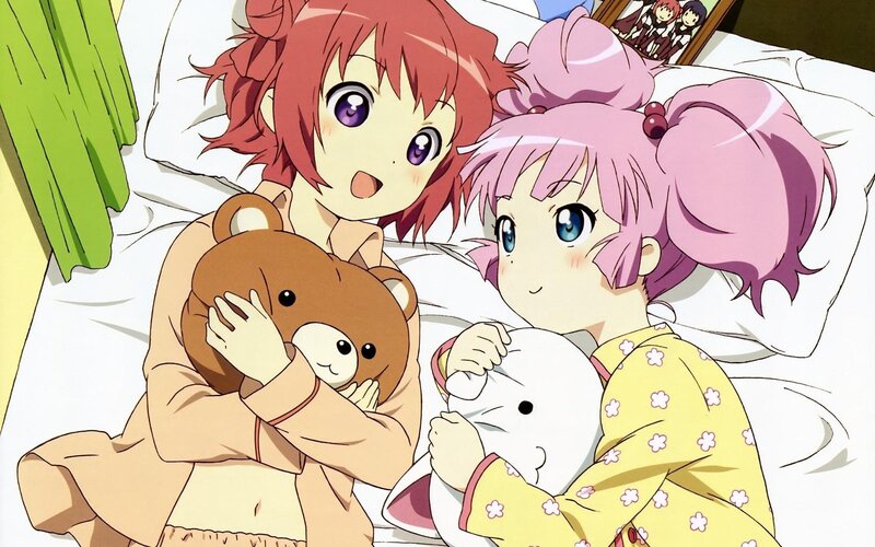 Two girls in pajamas with stuffed animals
