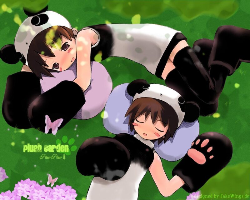 Two girls in panda costumes