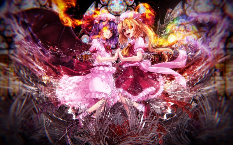 Two girls in pink dresses with fire