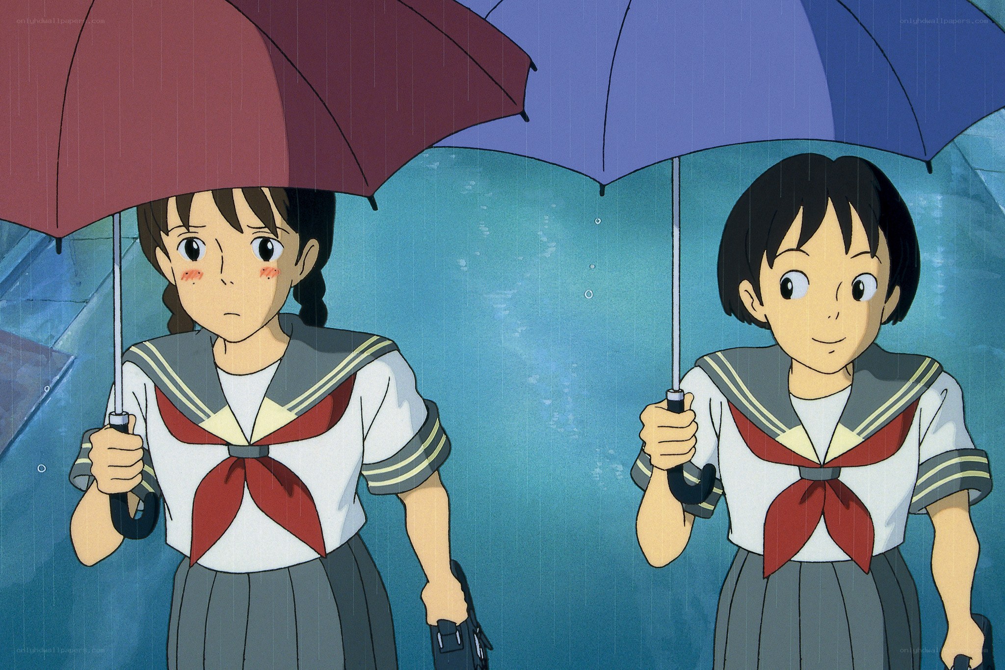 Two girls in rain with umbrellas