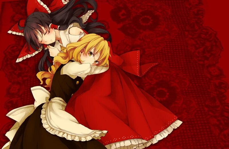 Two girls in red and black dresses