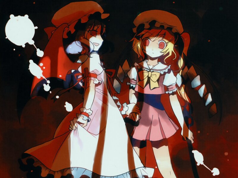 Two girls in red and white dresses