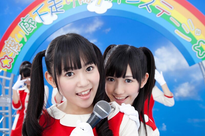Two girls in red and white outfits