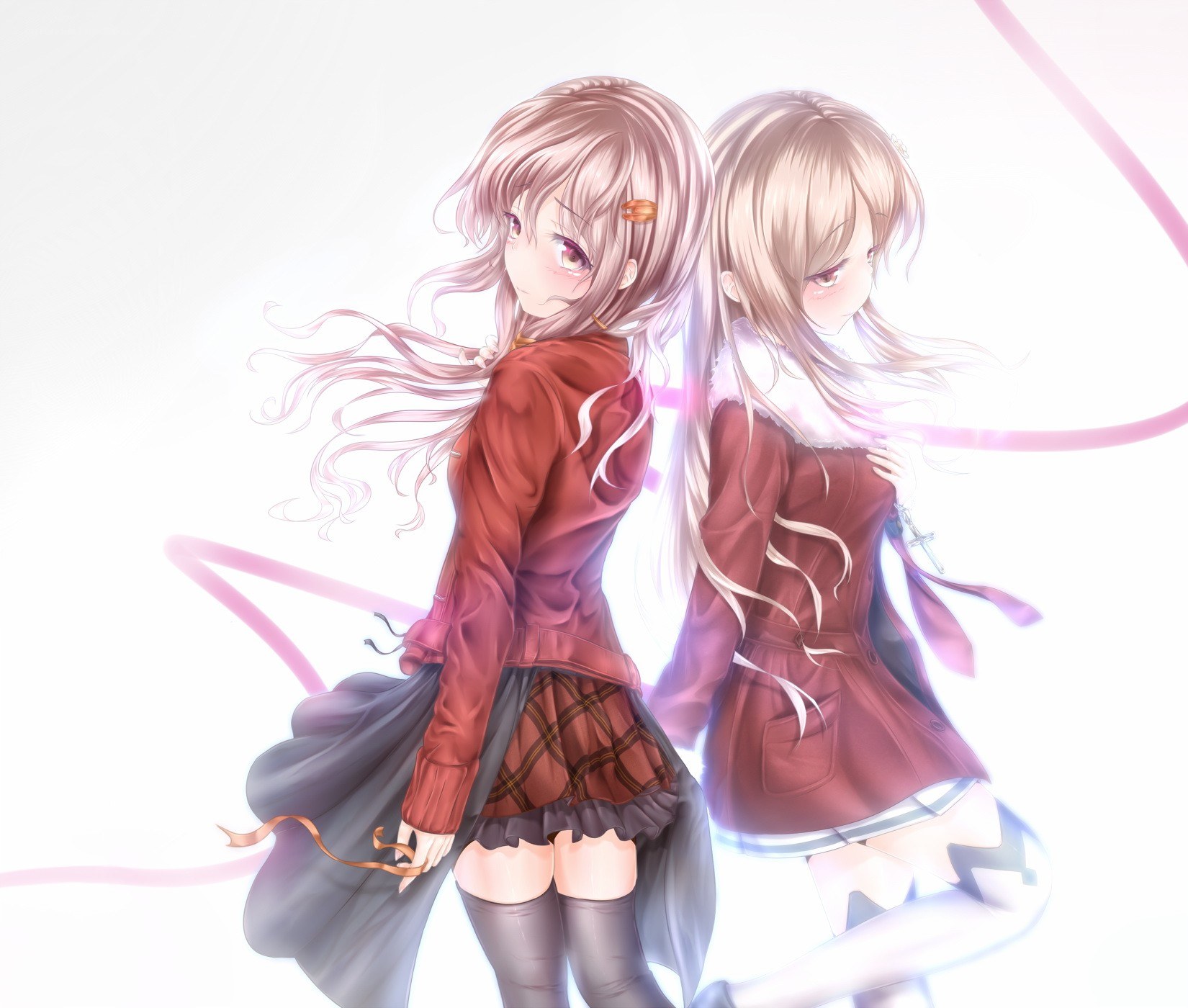 Two girls in red coats