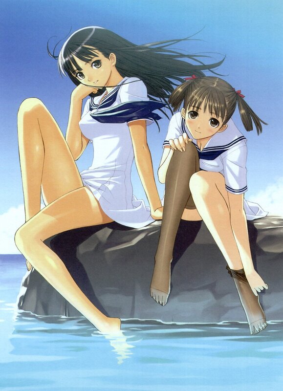 Two girls in school uniforms by the water