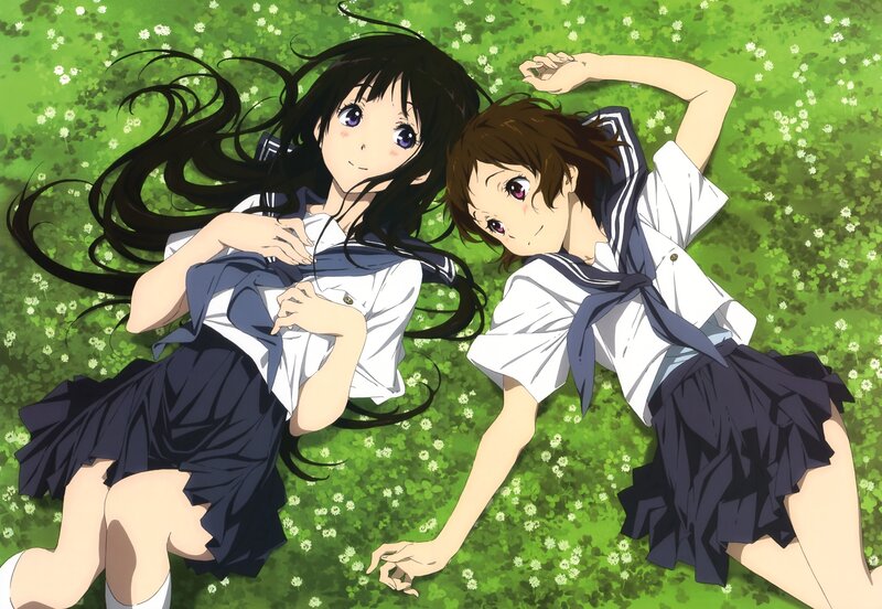 Two girls in school uniforms on grass