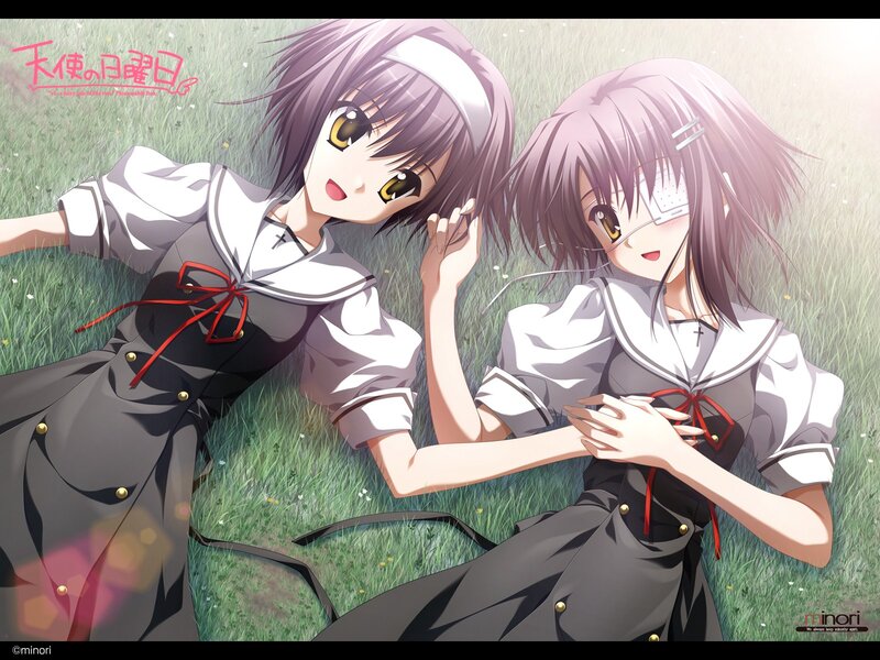 Two girls in school uniforms on grass