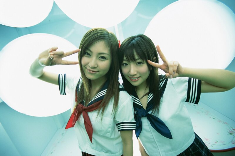 Two Girls in School Uniforms — White, Playful, Photograph