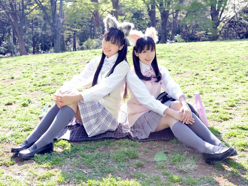 Two girls in school uniforms with animal ears