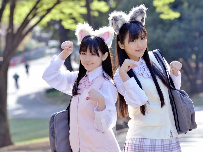 Two girls in school uniforms with animal ears