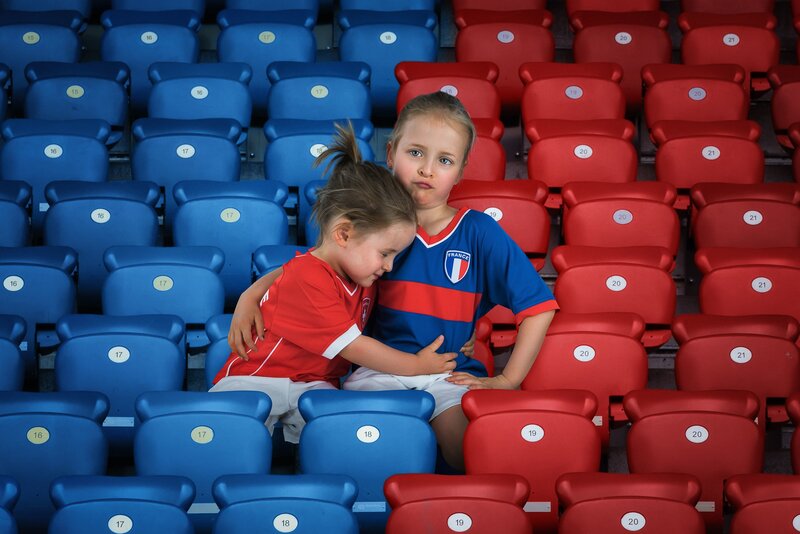 Two Girls in Stadium Seats