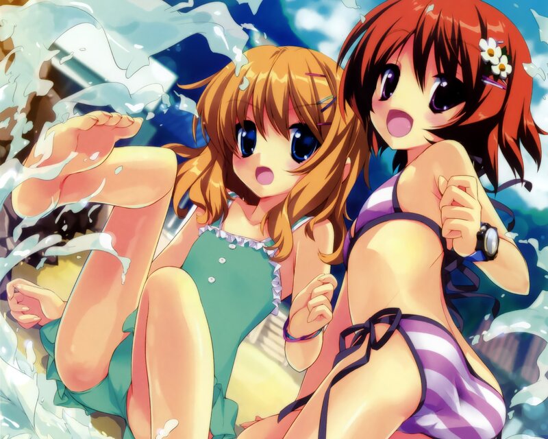 Two girls in swimsuits at the beach