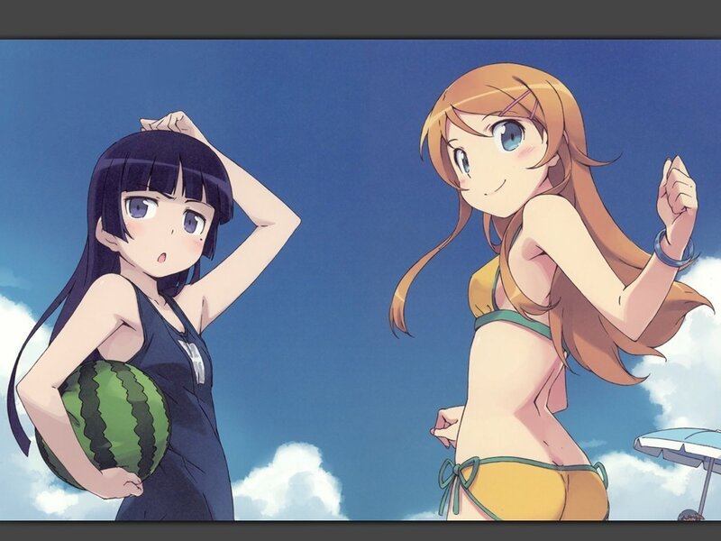 Two girls in swimsuits at the beach