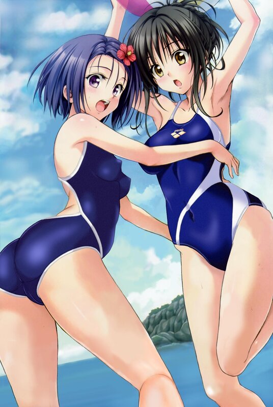 Two girls in swimsuits at the beach