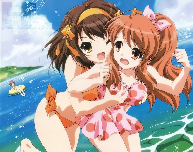 Two girls in swimsuits at the beach