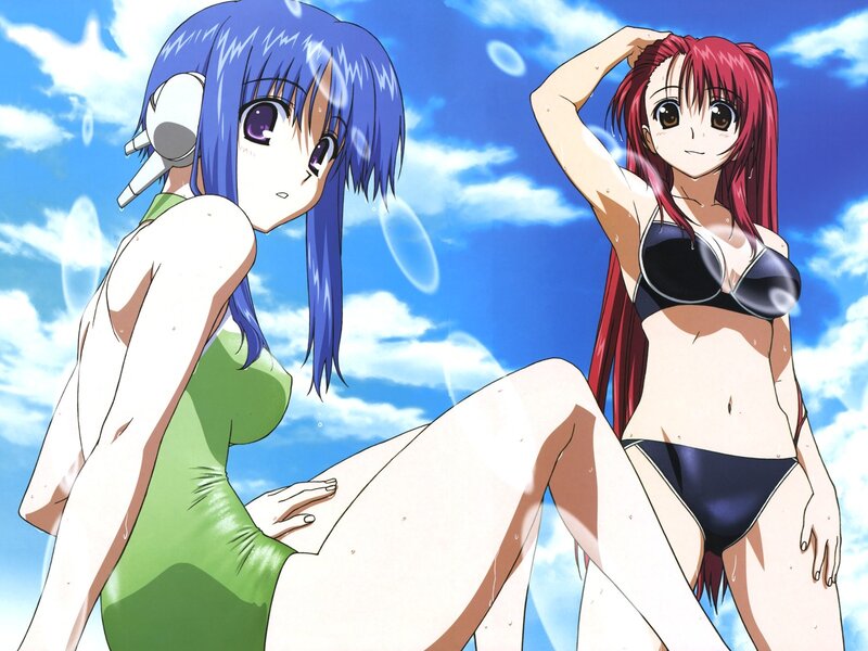 Two girls in swimsuits at the beach