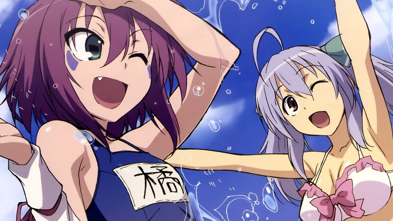 Two girls in swimsuits at the pool