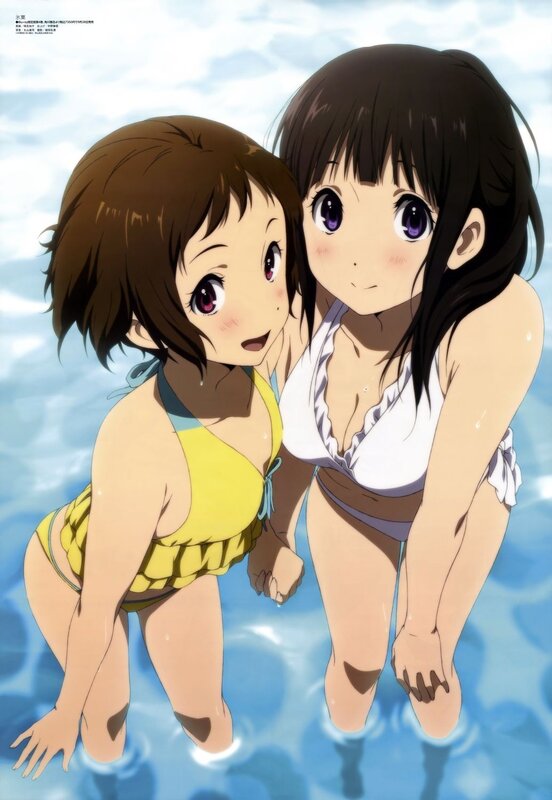 Two girls in swimsuits at the pool